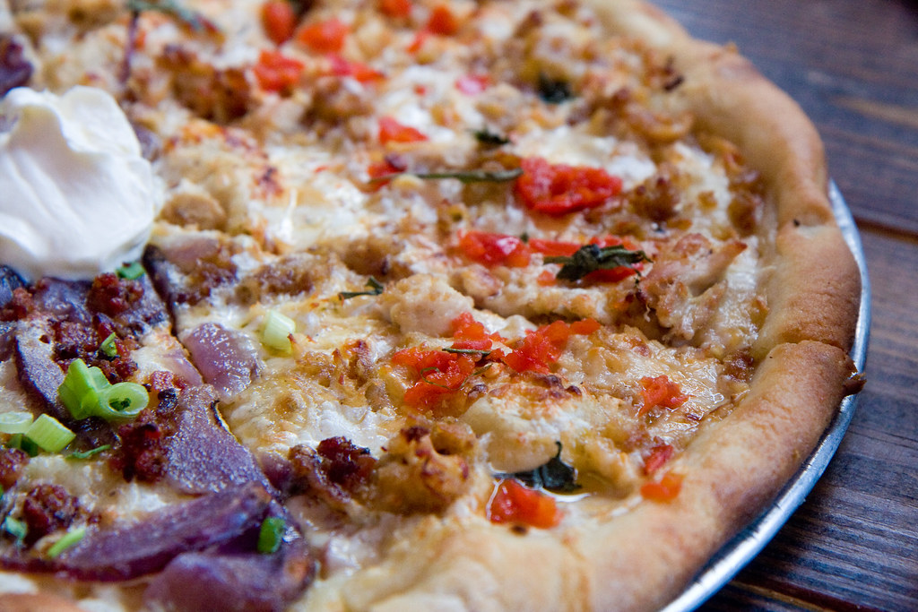 Pretzel parm pizza with garlic chip bechamel, smoked gouda… Flickr