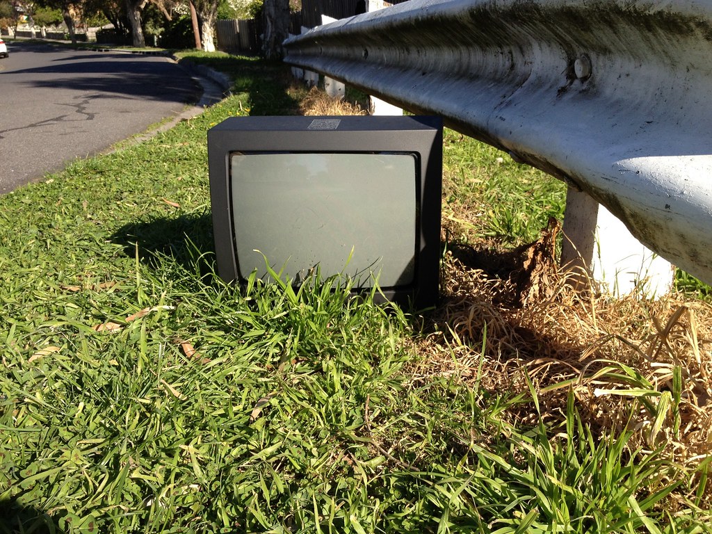 TV is dead Old tv on the side of the road. Please credit … Flickr