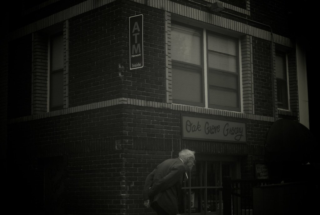 L1102860 Man walking by Oak Grove Grocery Minneapolis. Sep… Flickr