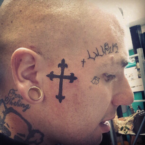 Second tattoo today. Cross on rapper b3_the_shark face