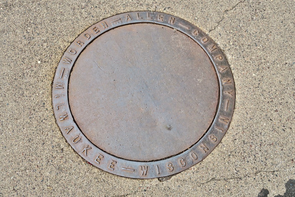 WordenAllen Company, Ironwood, MI Manhole cover in an Iro… Flickr