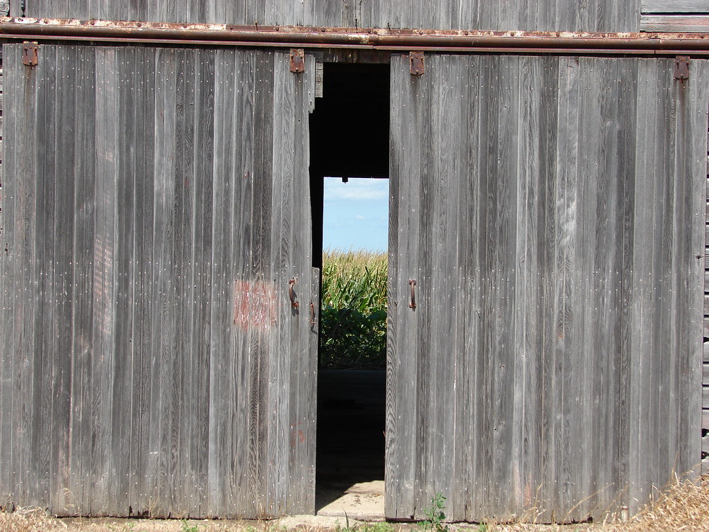 cornfield through a corn crib The doors on this old corn c… Flickr