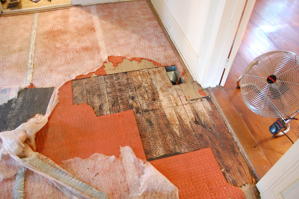 Pulling up carpet, tile, mat and glue Carey... Flickr