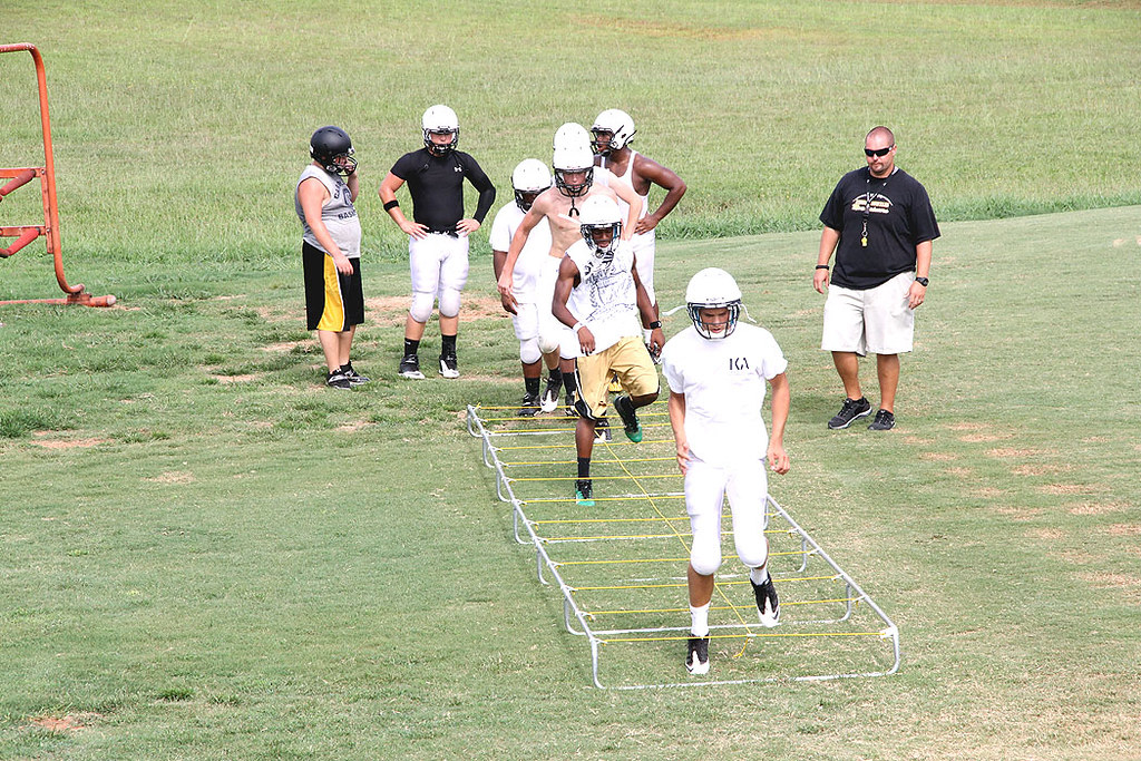 Footballrope Assistant coach Dustin Morehead watches as p… Flickr