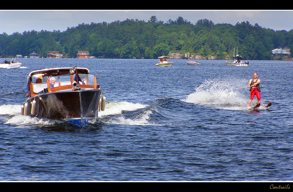 Water skiing behind "Tolka", A Canadian wooden boat with a… Flickr