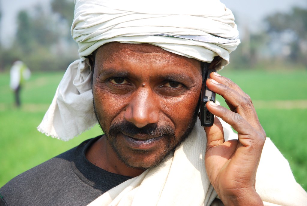 Farmer with his mobile phone in Bihar, India A farmer spea… Flickr