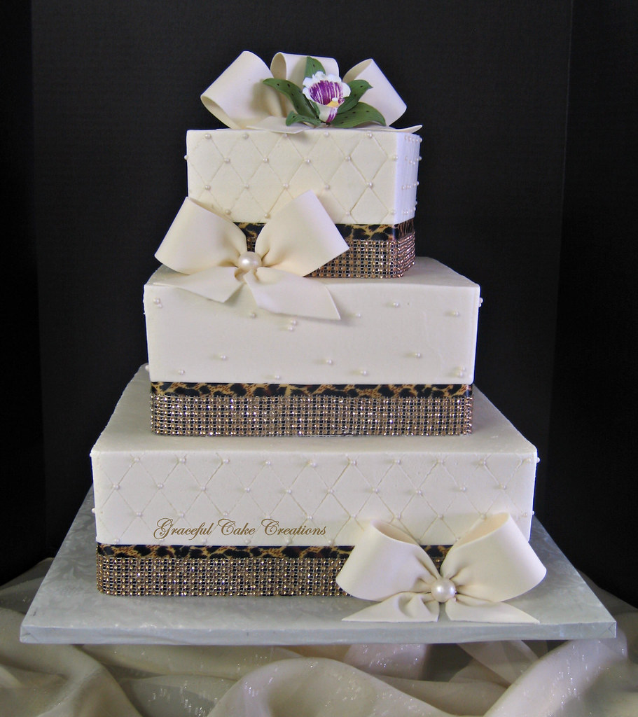 Elegant Ivory Buttercream Wedding Cake with Bling Ribbon a… Flickr