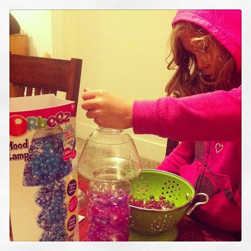 Filling her Orbeez Mood Lamp (with little gel beads that s… Flickr
