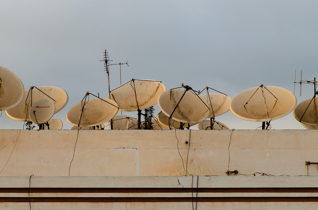 201209180129.jpg Some satellite dishes on the roofs of … Flickr