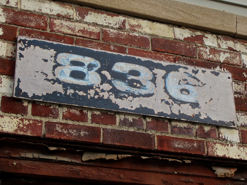 836, Peoria, IL Faded address on the front of a building i… Flickr