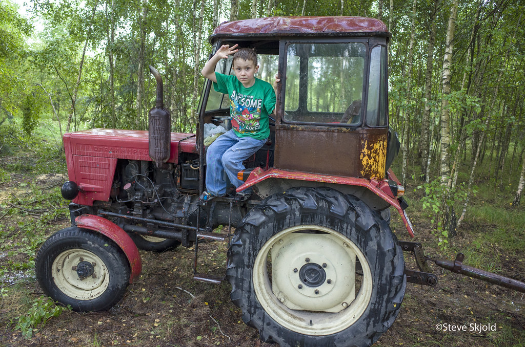 Tractor Wave Boy age 8 waving from doorway of small Polish… Flickr