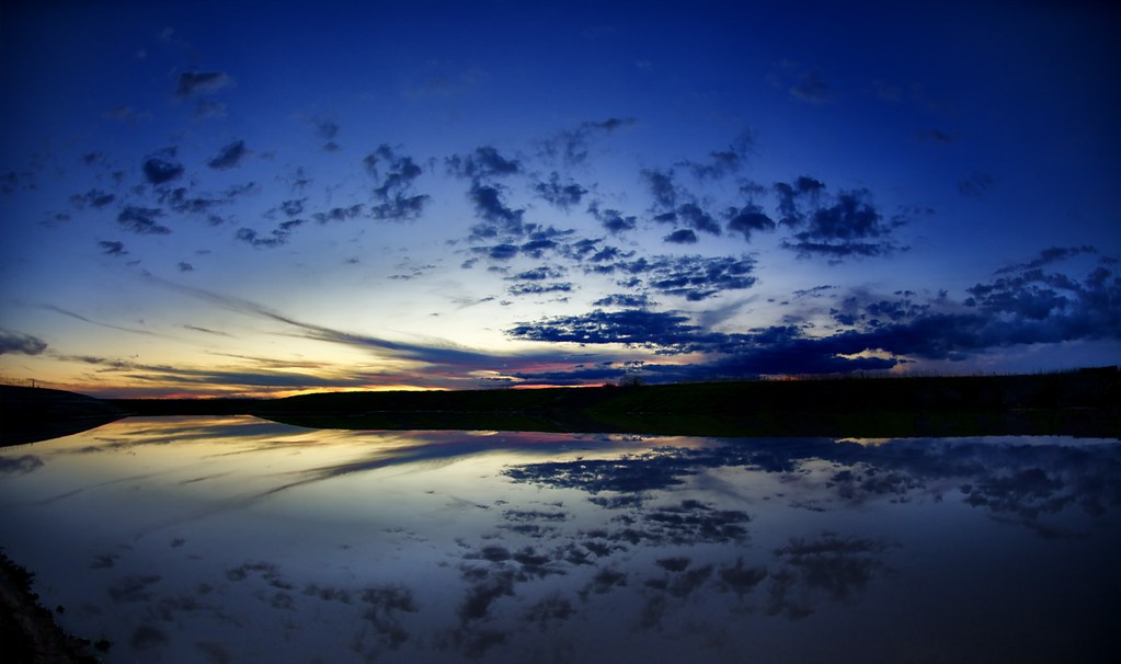 Skyfall Sunset over a retention pond in Katy, Texas Tom Haymes Flickr