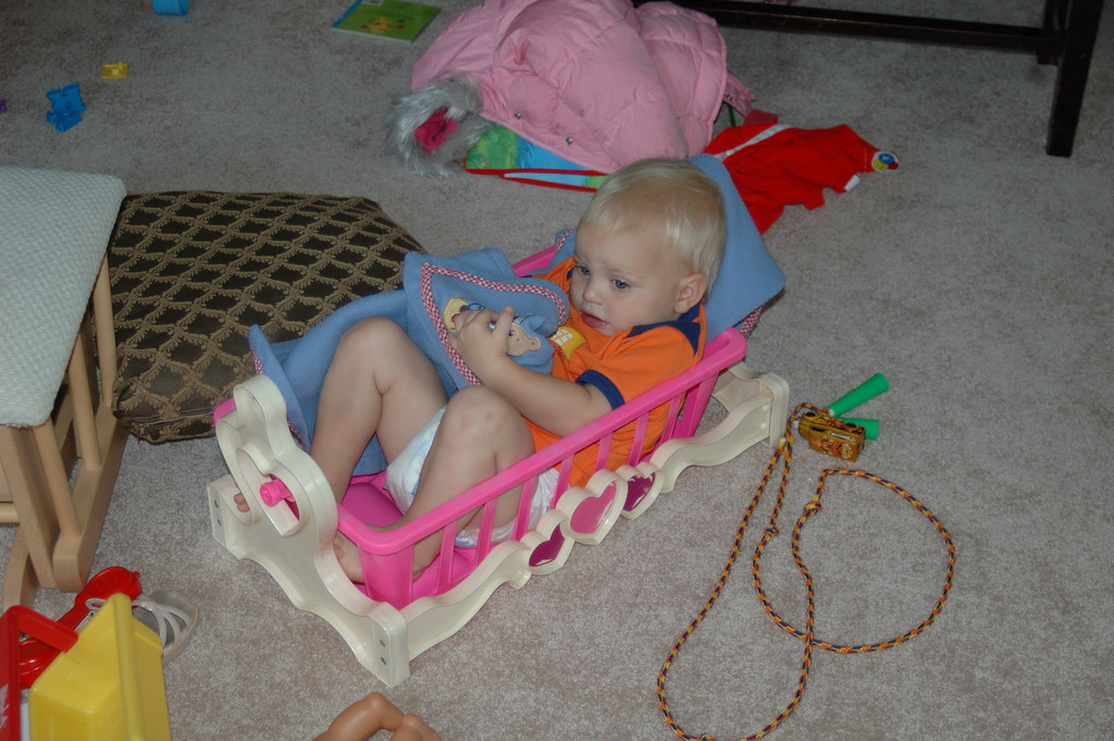 Joey in Toy Baby Bed Joey likes to pretend he is a doll an… Flickr