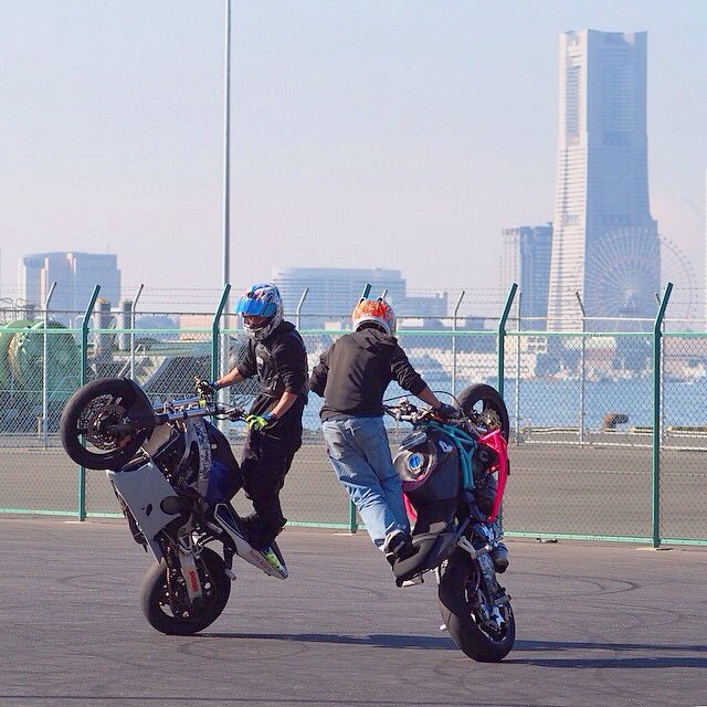 Some guys in Yokohama Port motorcycle stunt riding Vincent Van den