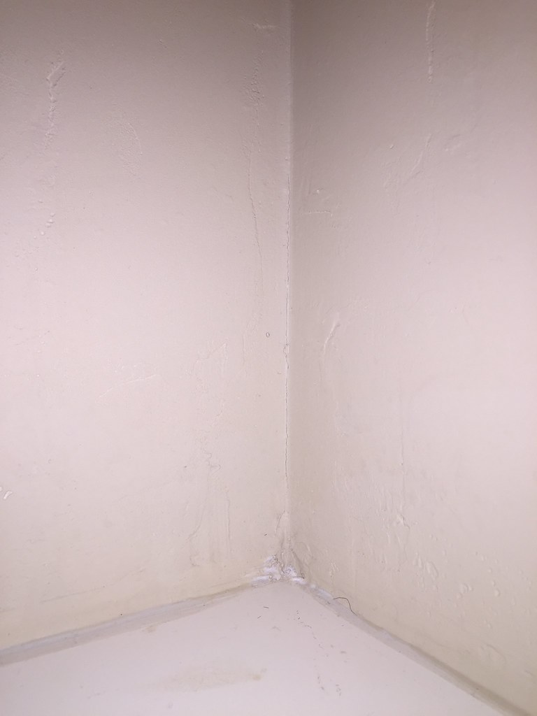 Drywall crack above shower Justin Kussow Flickr