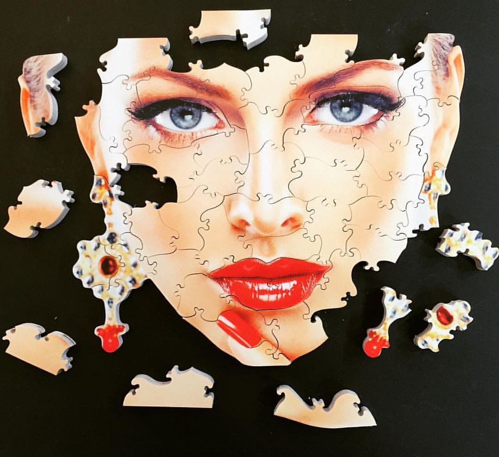 A beautiful face hand cut wooden jigsaw puzzle. 53 pieces.… Flickr