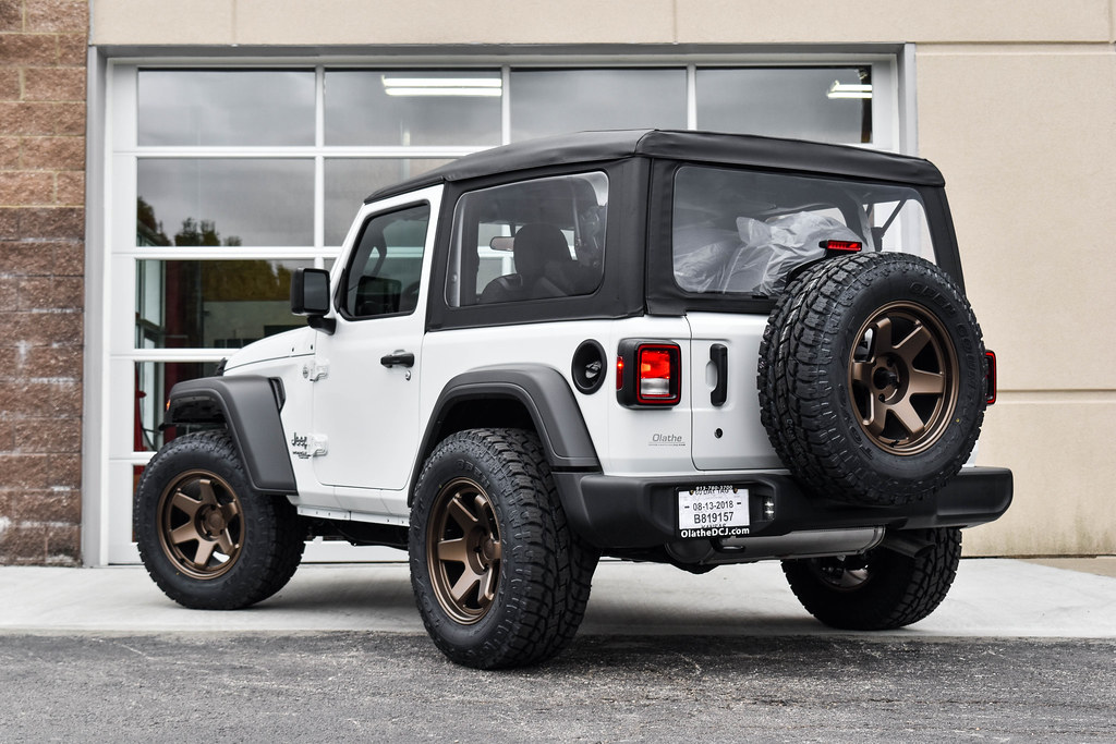 Jeep JL Wrangler on Black Rhino Roku matte bronze wheels 4 a photo