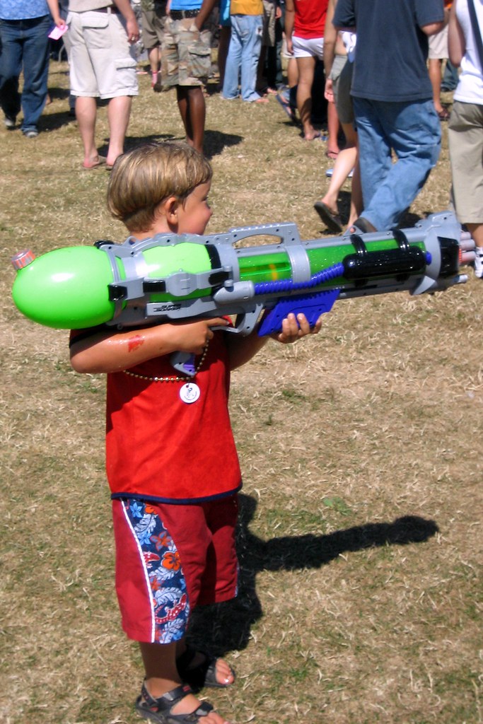 Kid with Watergun The water gun was nearly as big as he wa… Flickr