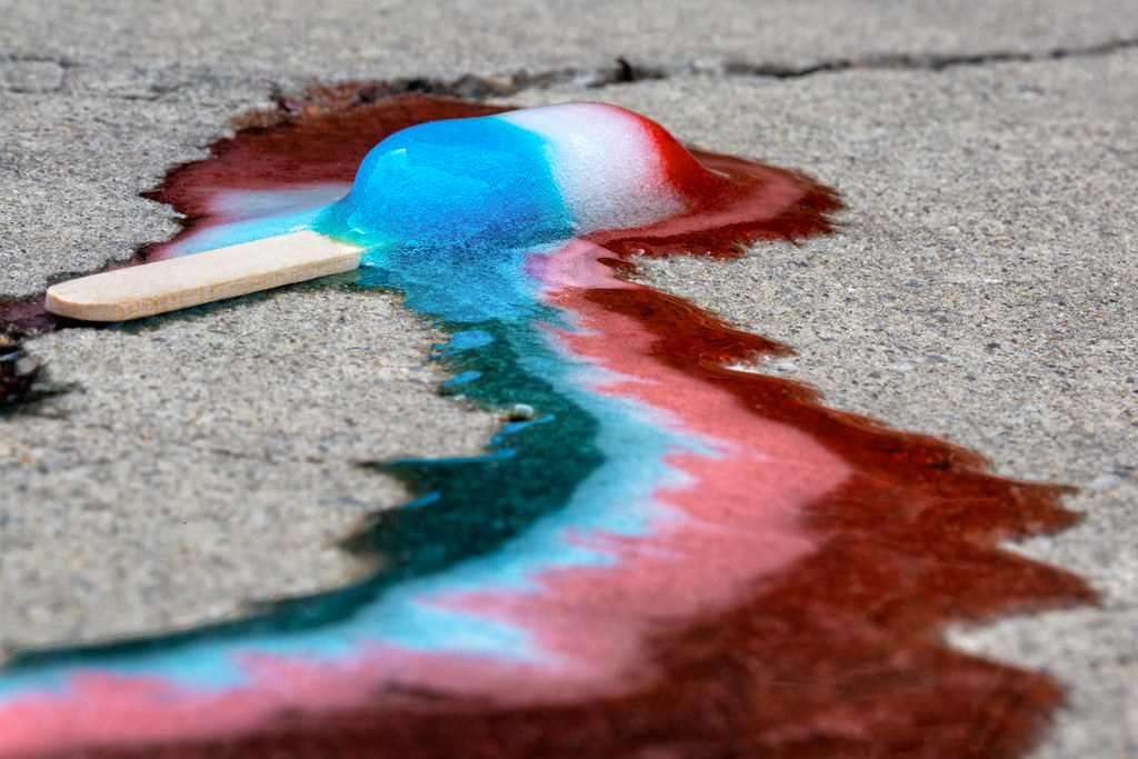 Bombs Away! A melting Bomb Pop on a sidewalk means one thi… Flickr