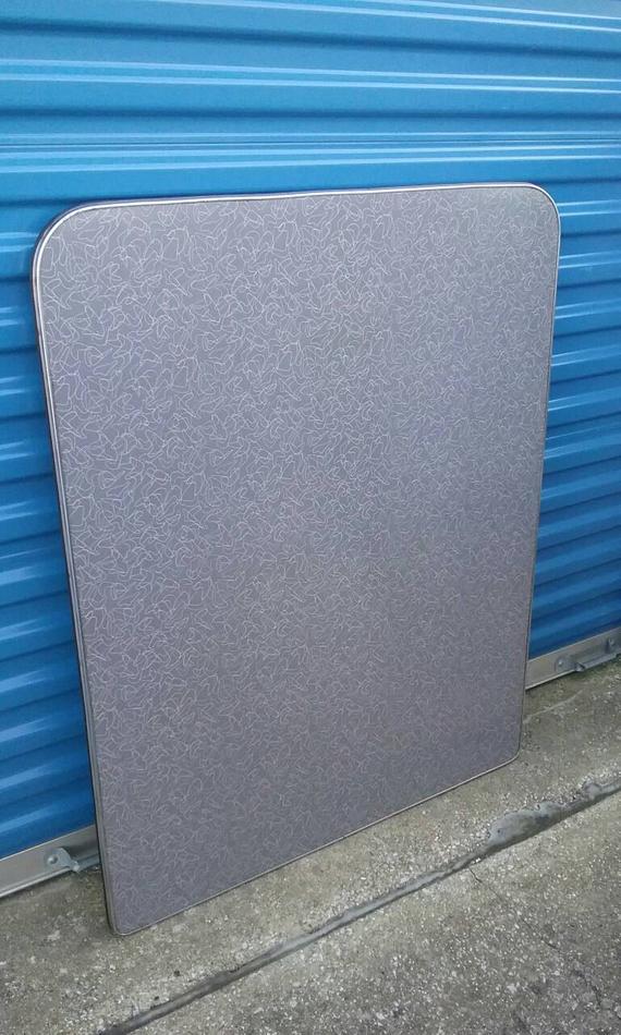 With Two Silver Boomerangs Logo