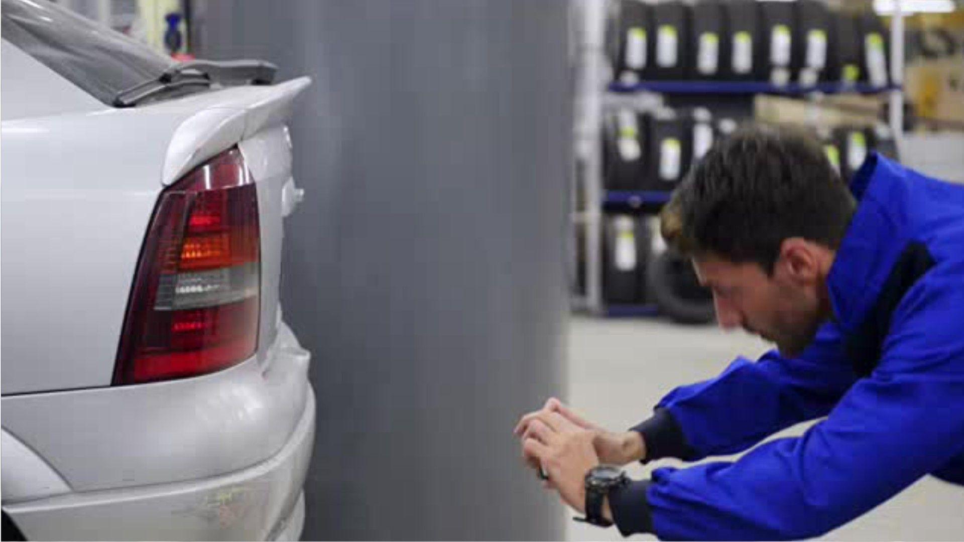 Automotive Damage Adjuster Logo