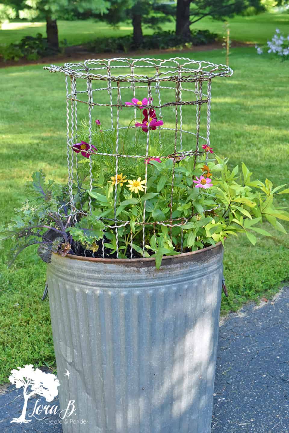 Repurposed Garbage Can Planter with Vintage Fencing Lora Bloomquist