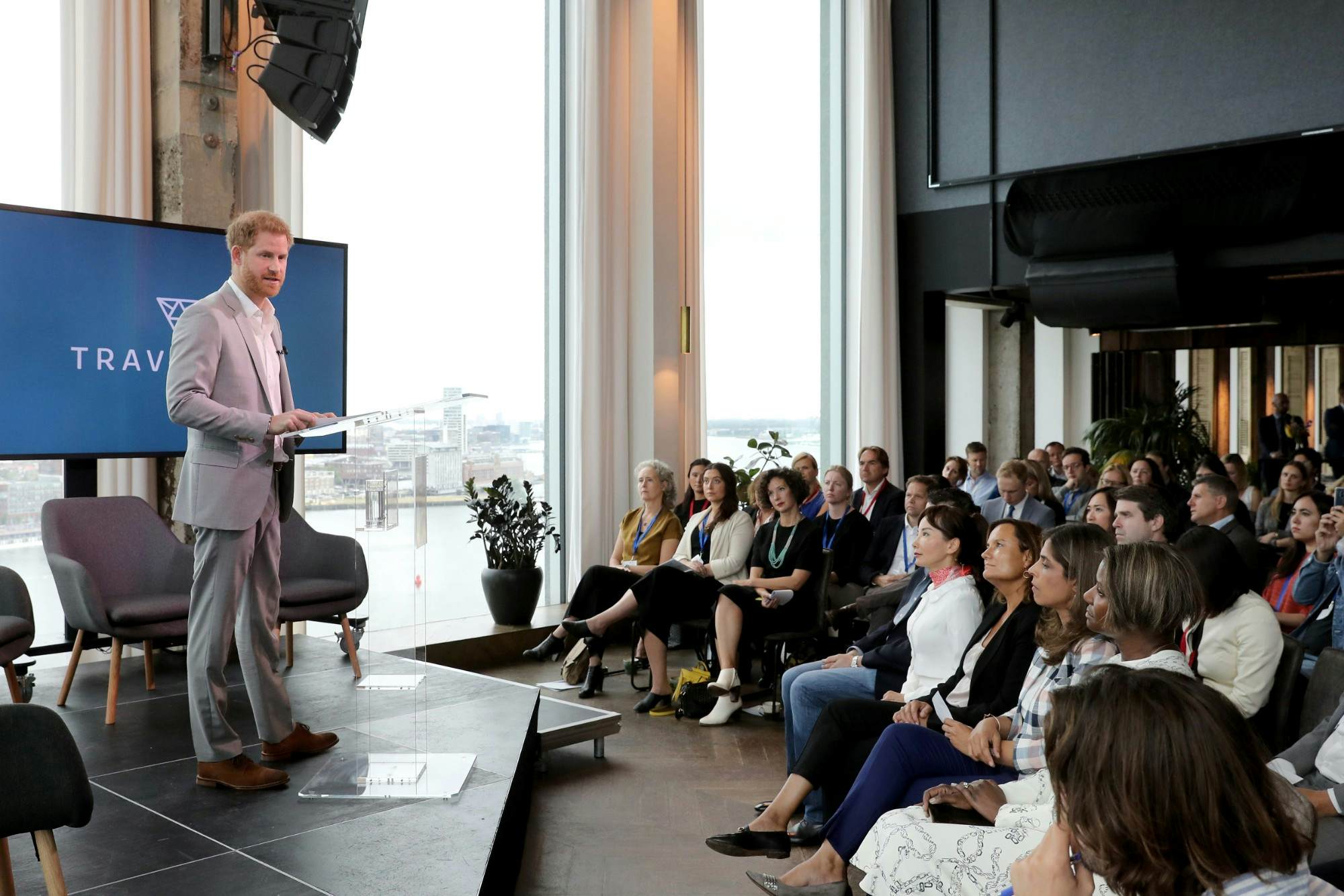 Prince Harry defends use of private jets at the launch of his