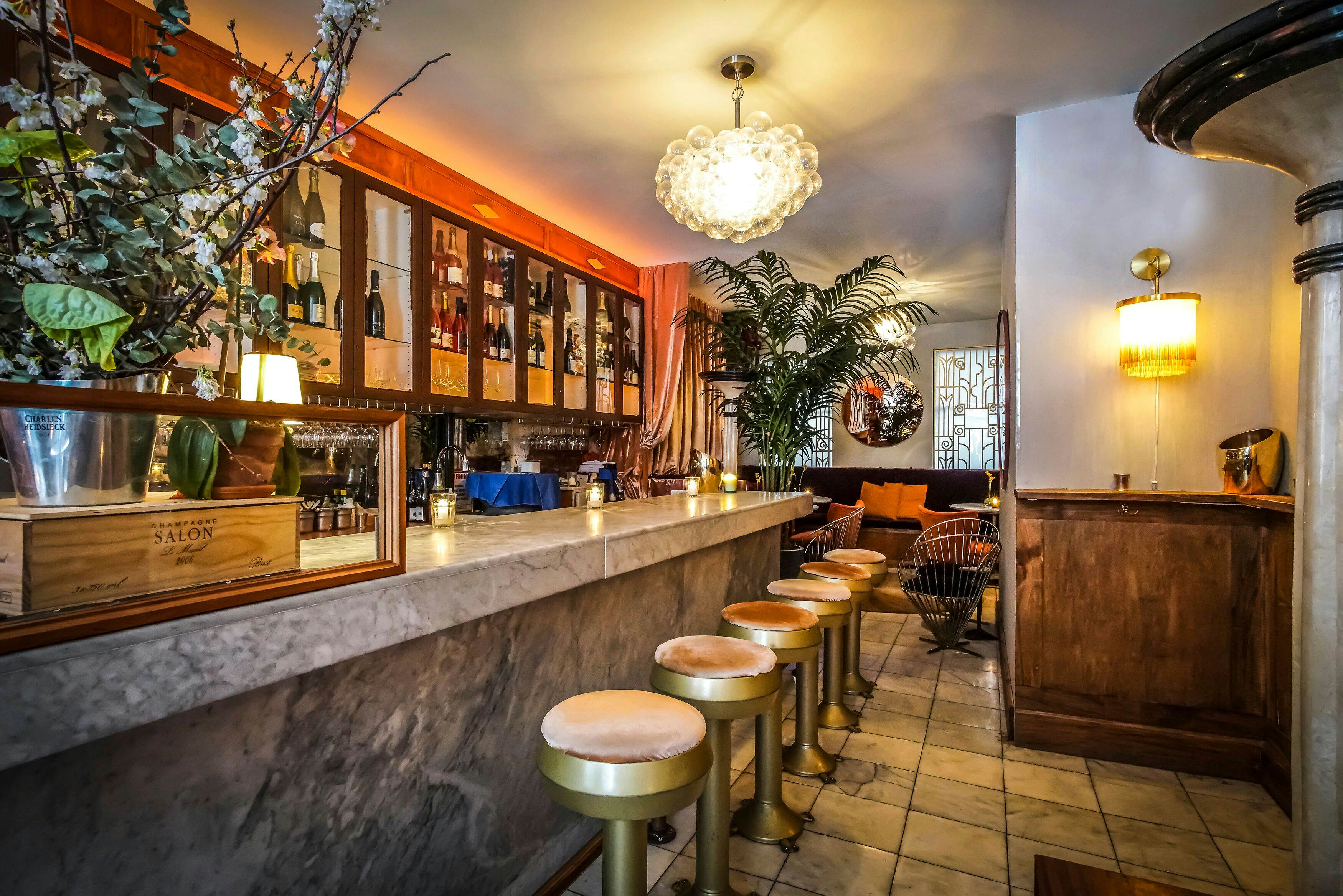 Pop bottles at these Champagne bars around the US Lonely