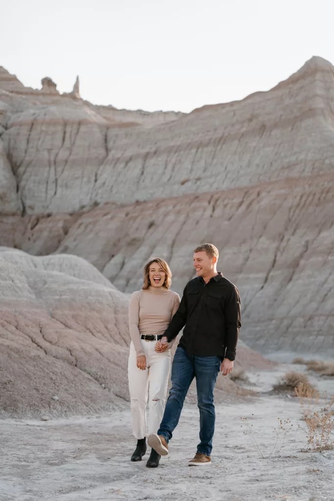 couple hiking at badlands national park