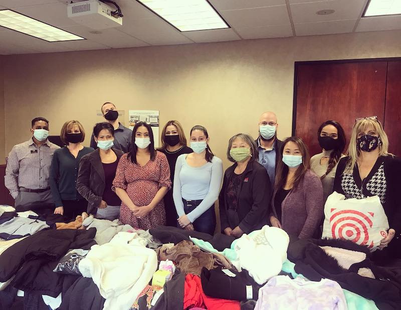 Lyon Real Estate Donates 2,593 New Coats in 10thAnnual Coat Drive