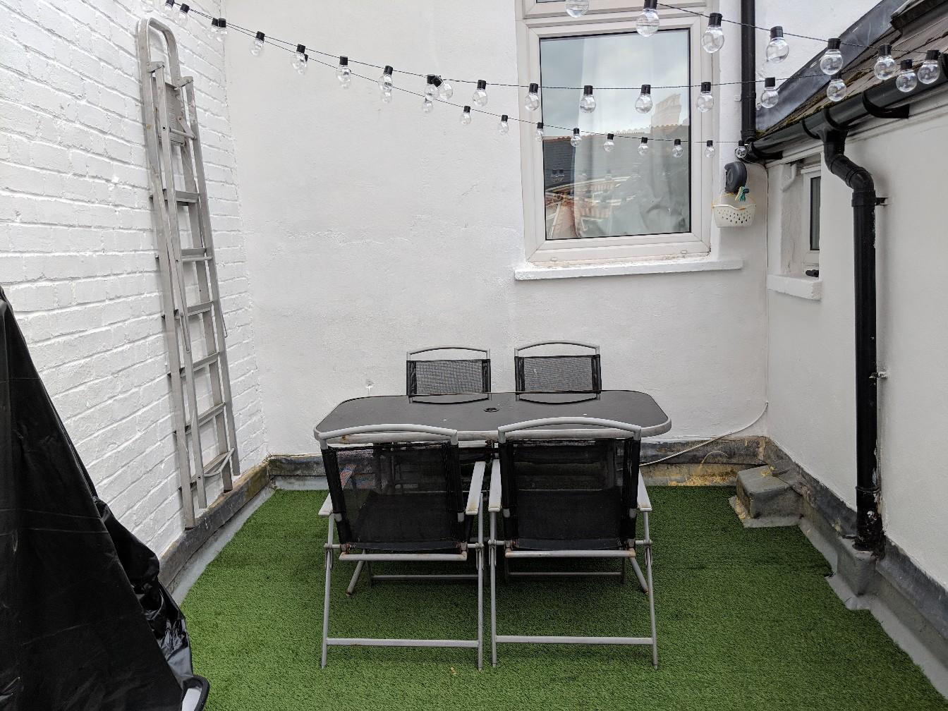 black glass garden table and chairs in CF64 Penarth for £25.00 for sale