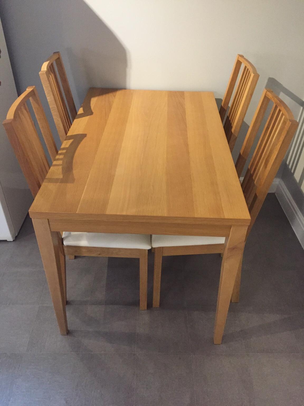 Oak veneer dining table and four chairs in NG6 Nottingham for £60.00