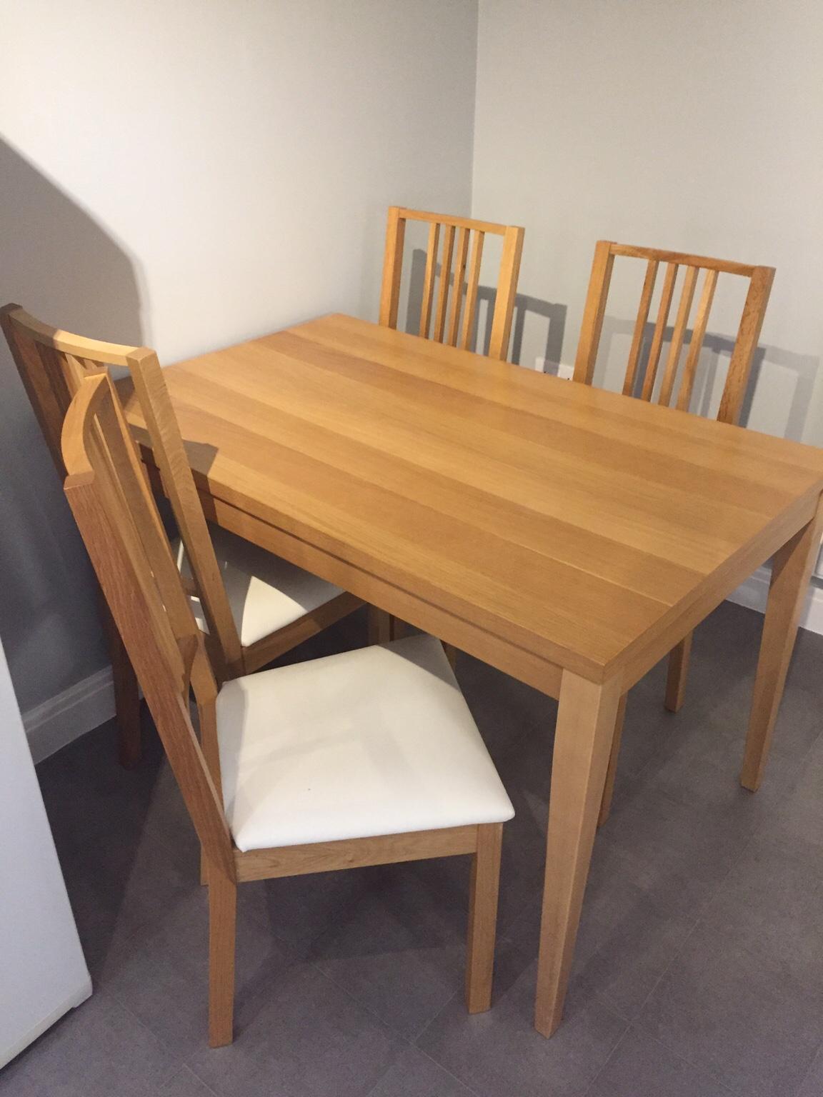 Oak veneer dining table and four chairs in NG6 Nottingham for £60.00