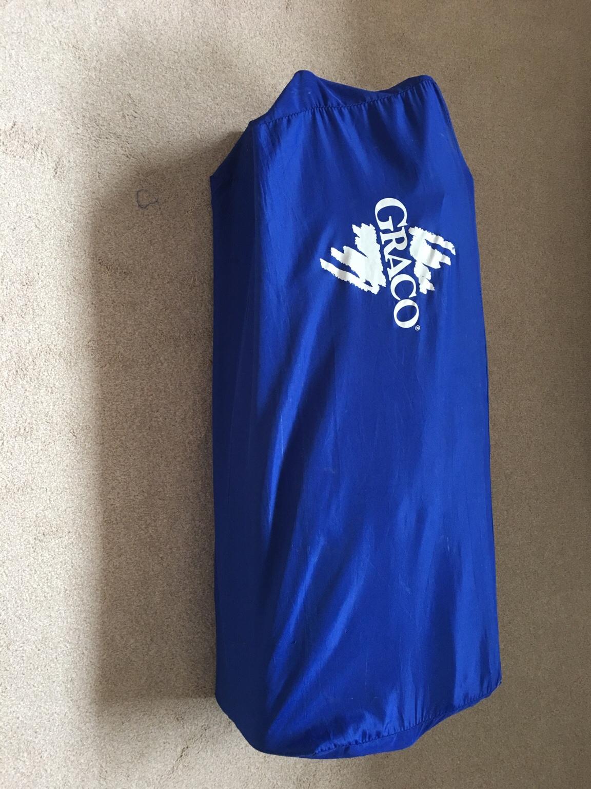 Graco Red, yellow, green and blue travel cot in RH10 Crawley for £5.00