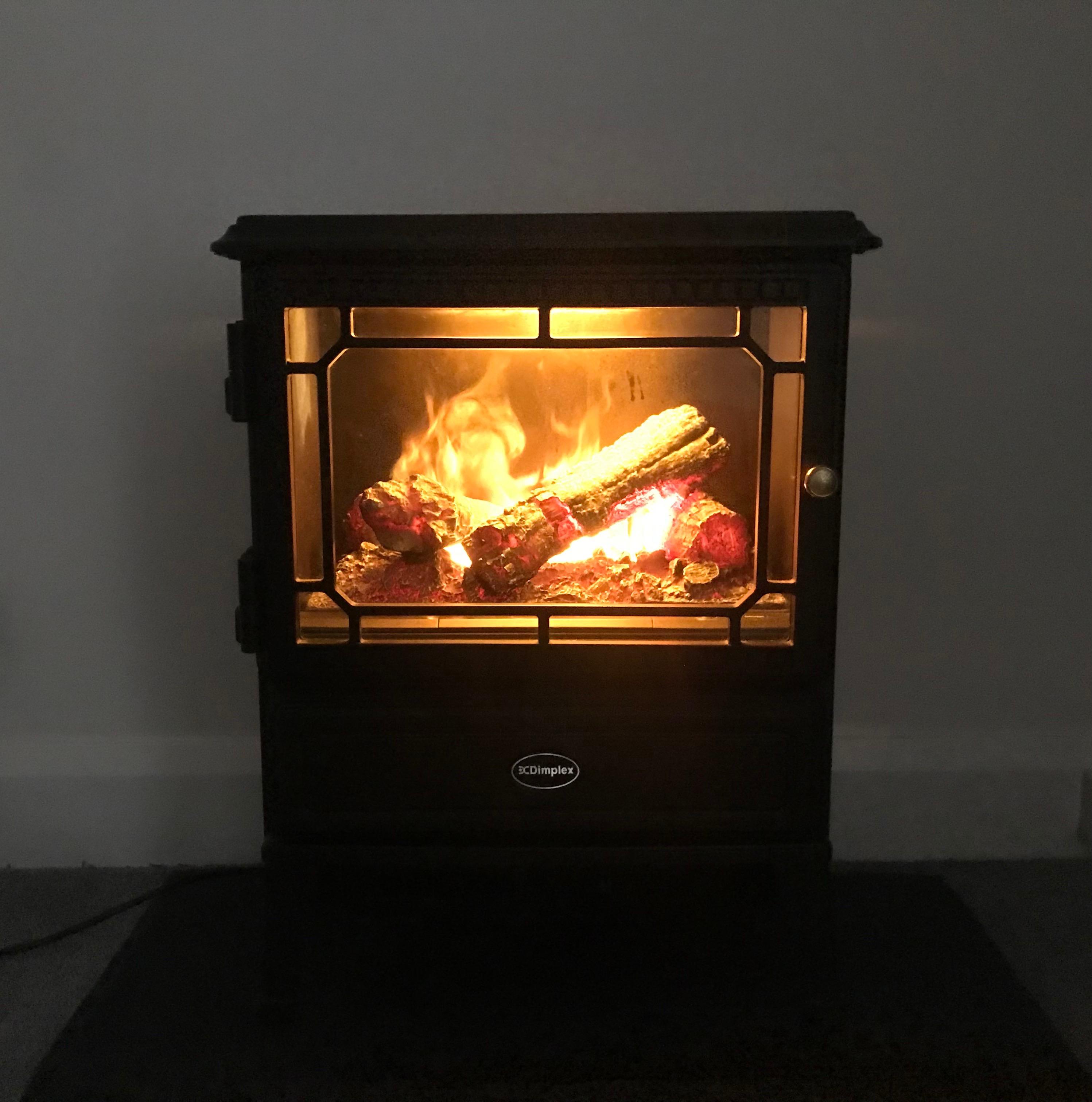 Dimplex OptiMyst Stove,Black with Hearth Pad in London Borough of