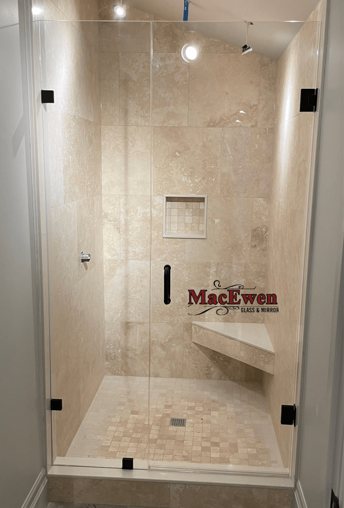 In-Line Frameless Glass Shower Enclosure Installed by MacEwen Glass - Matte Black Clamps, Hinges, Handle, 2 Clear Glass Pieces