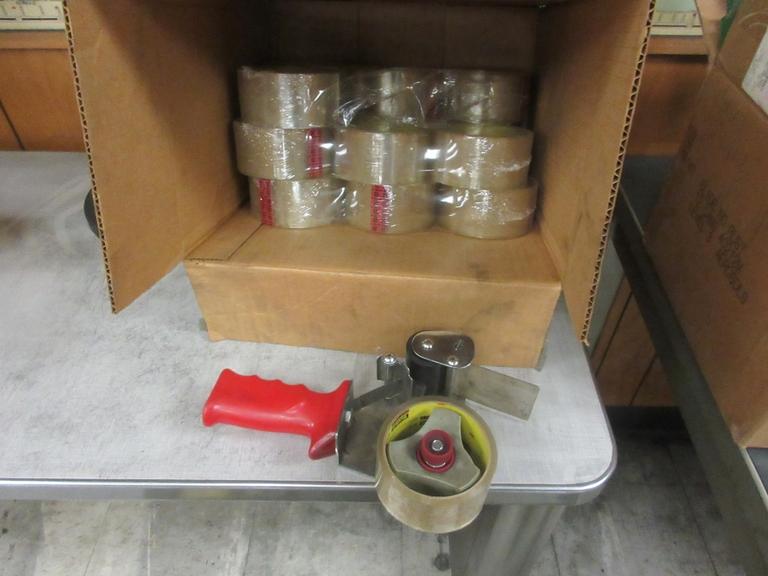 Machines Used Tape Gun and Rolls of Tape