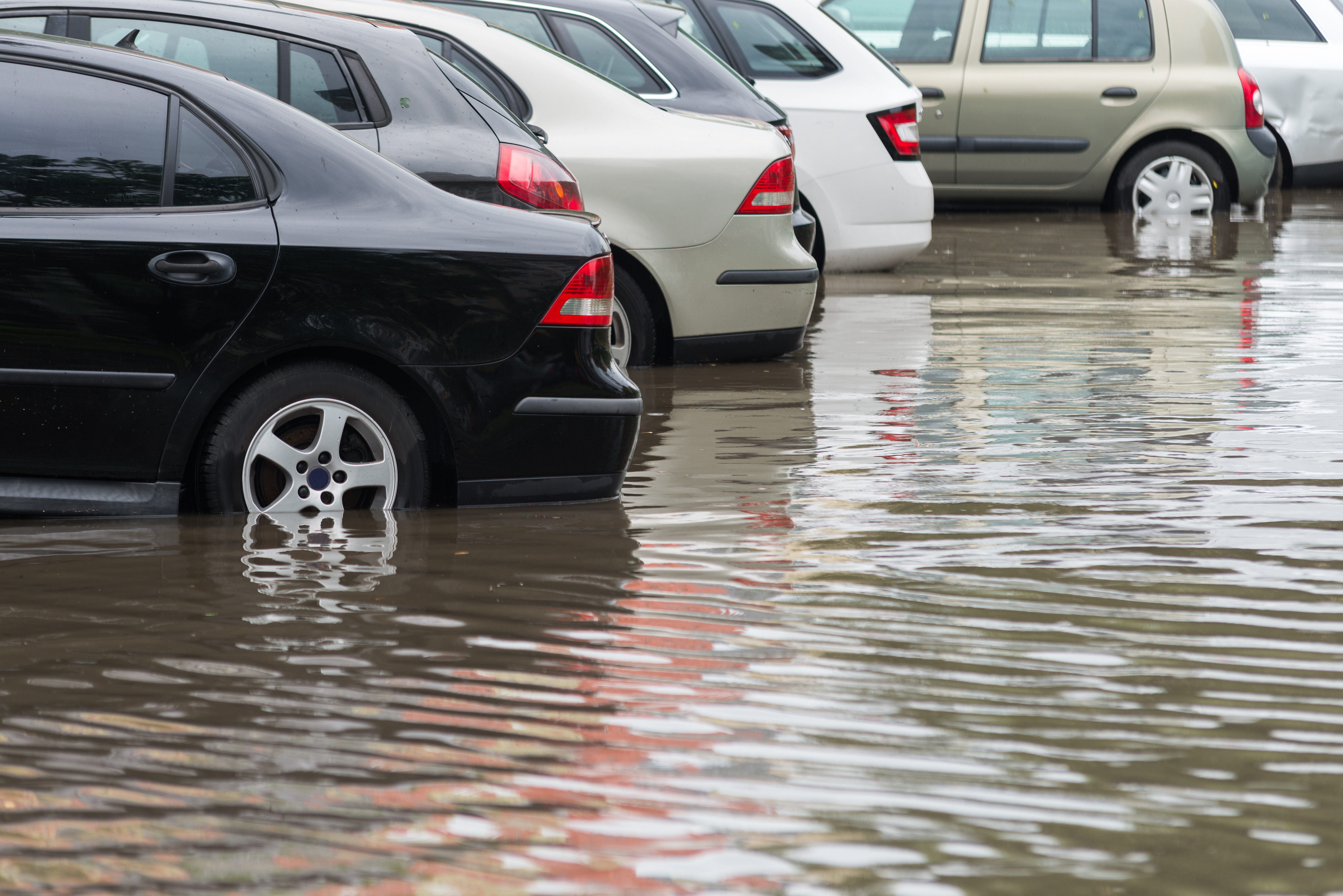 car in water after heavy rain and flood Mackoul Risk Solutions