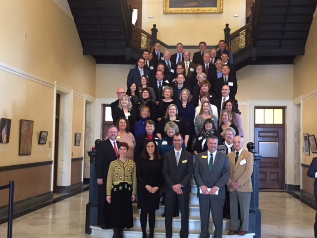 In Augusta, CU leaders proudly wave the CU flag Maine Credit Union League