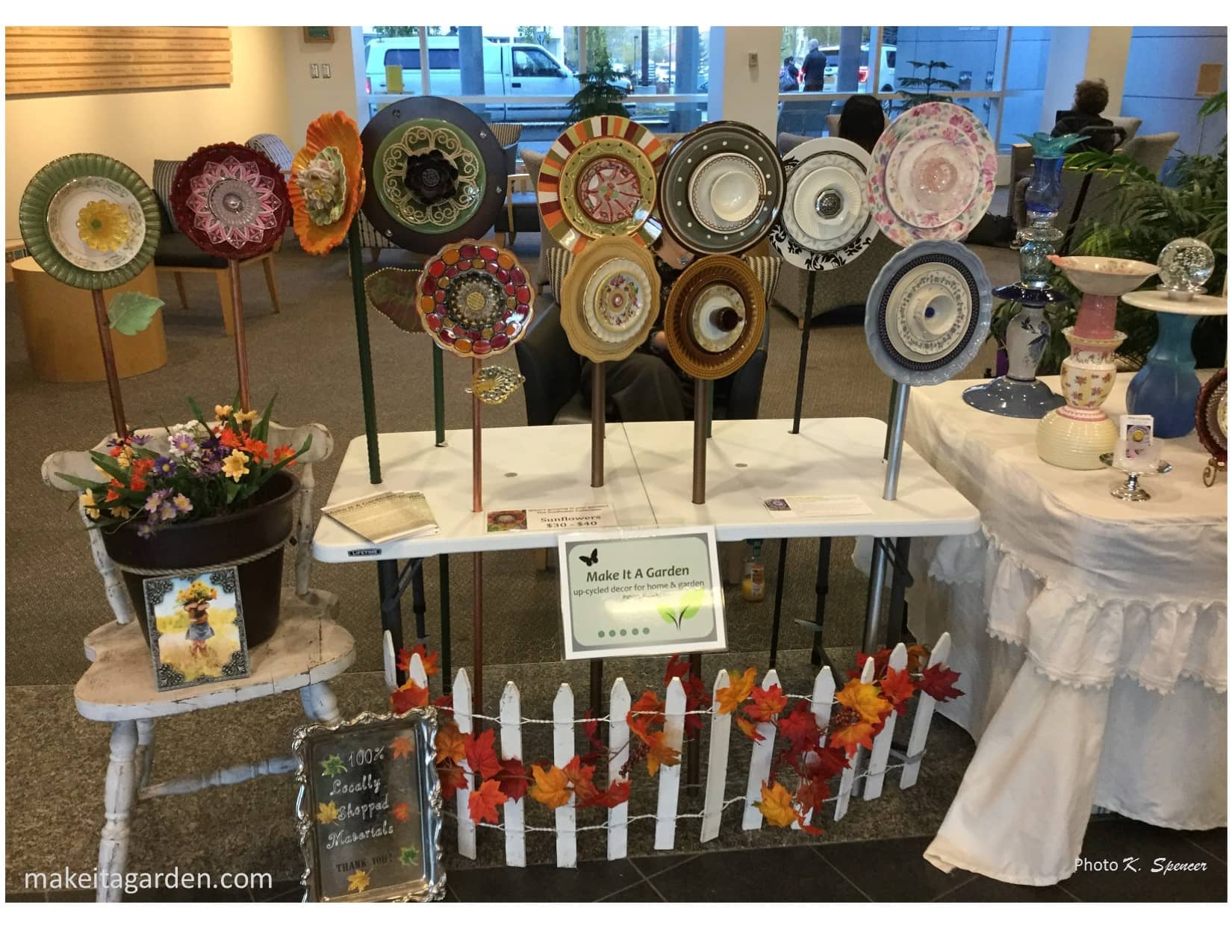 Photo: Craft Show display of the artist's dish flowers and the special table made to hold them up.