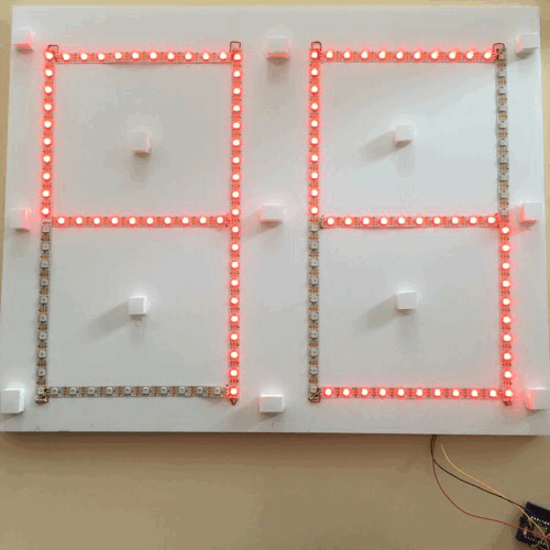 A 20 by 10 seven segment display made out of a cut string of LEDs counting