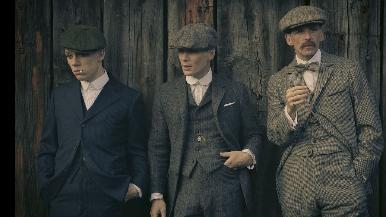 How To Dress Like a Peaky Blinder Man of Many