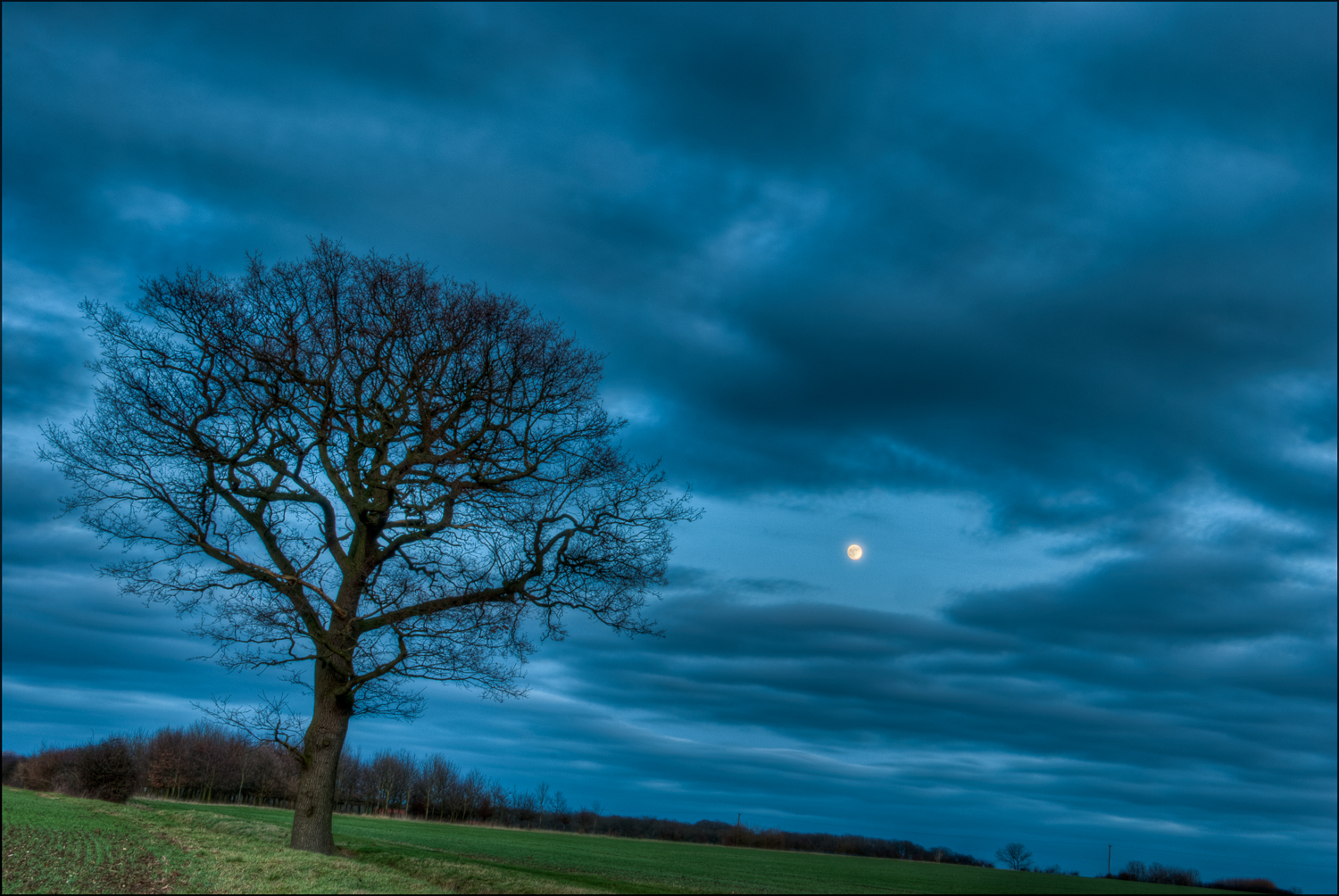 Moonrise over Berners Roding in Essex by Mark Seton Photography by