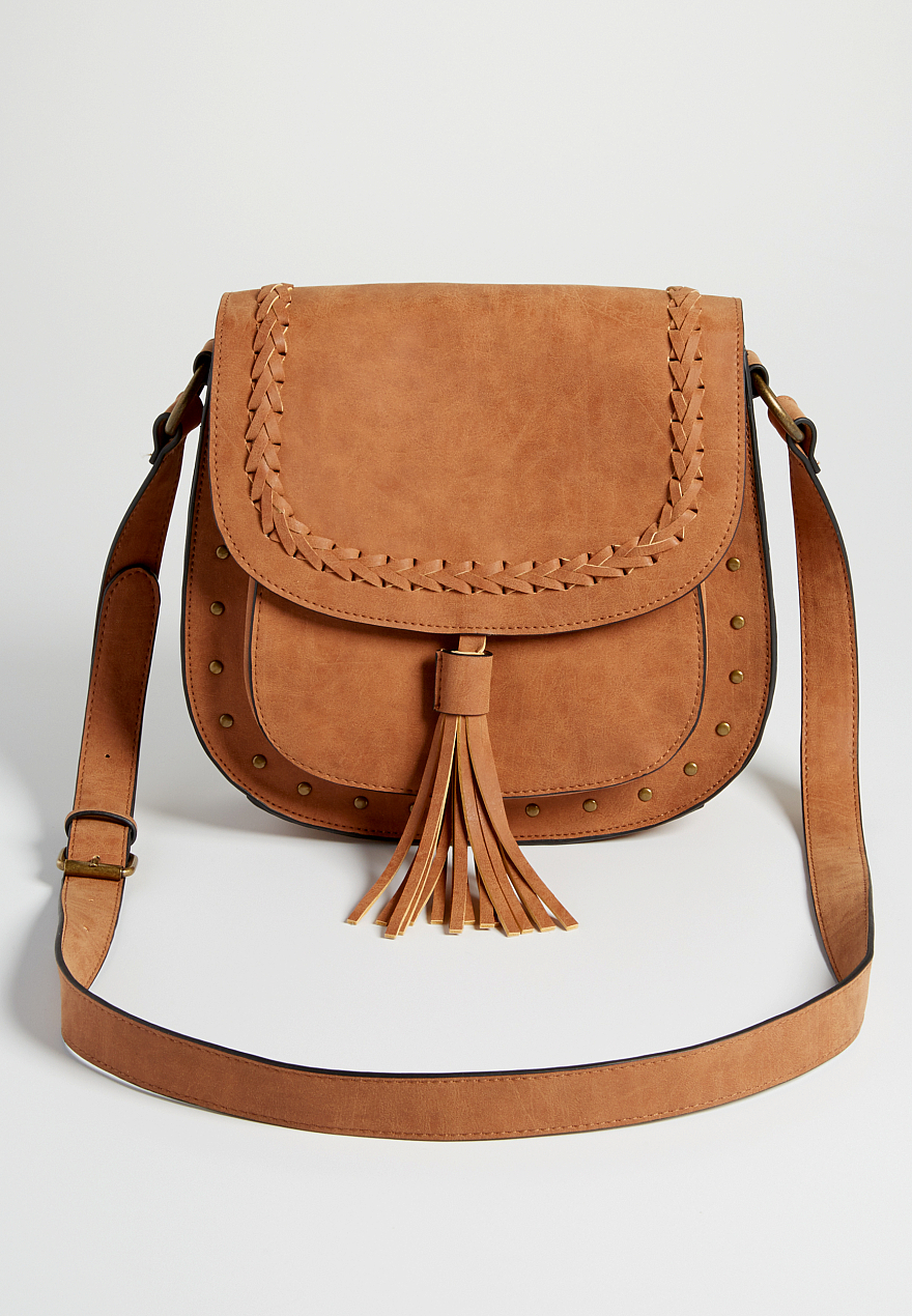 crossbody saddle style bag with tassel and studs maurices