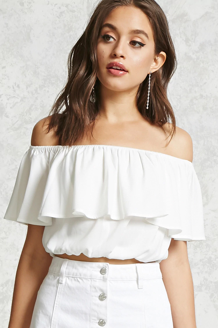 A cute off the shoulder crop top with ripped denim and sandals makes for the perfect casual style for a day in the city. I'm in love with this outfit!
