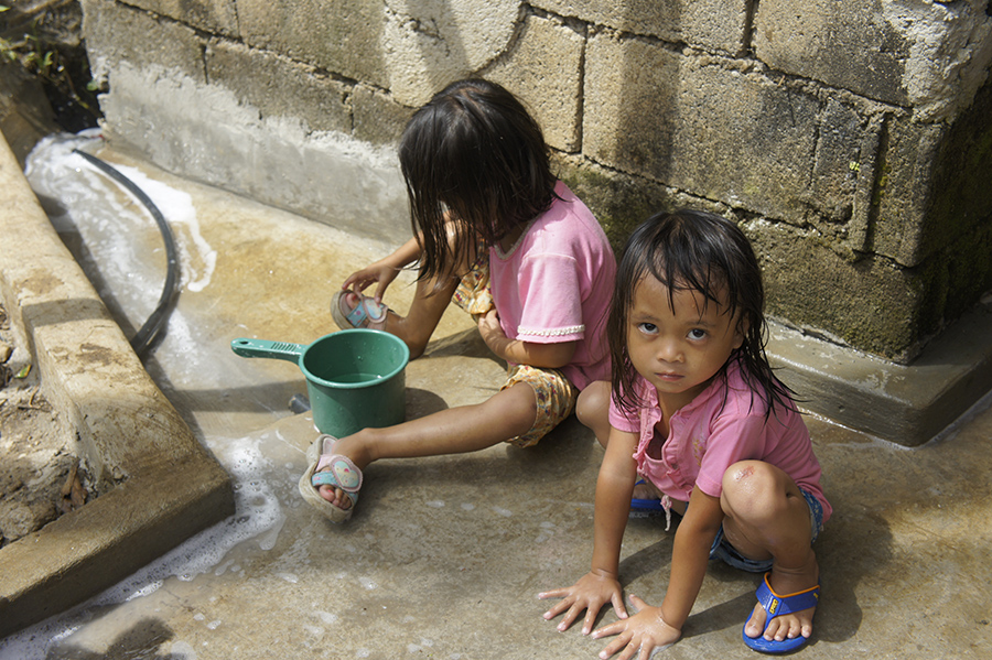 Girls in the Philippines playing in water