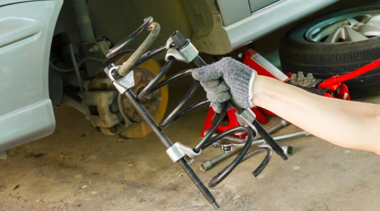 5 Symptoms of a Bad Suspension/Coil Spring, Location, & Replacement Cost