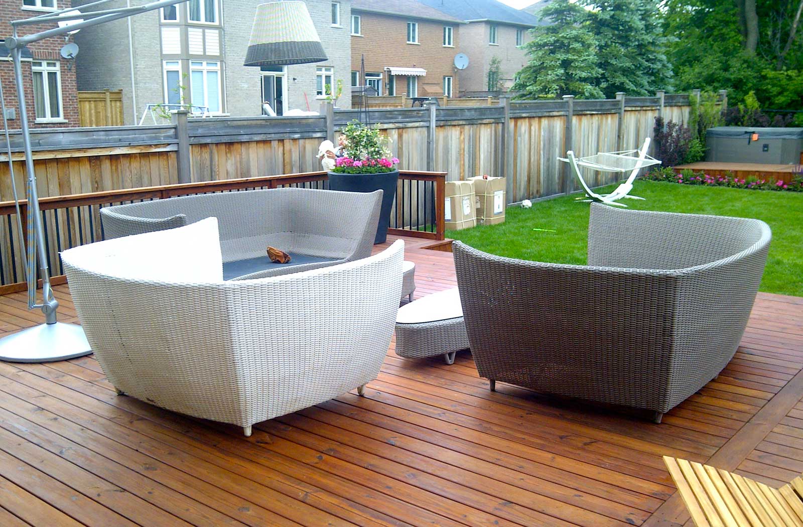 PVC deck with glass railings and walkout basement Toronto Landscaping