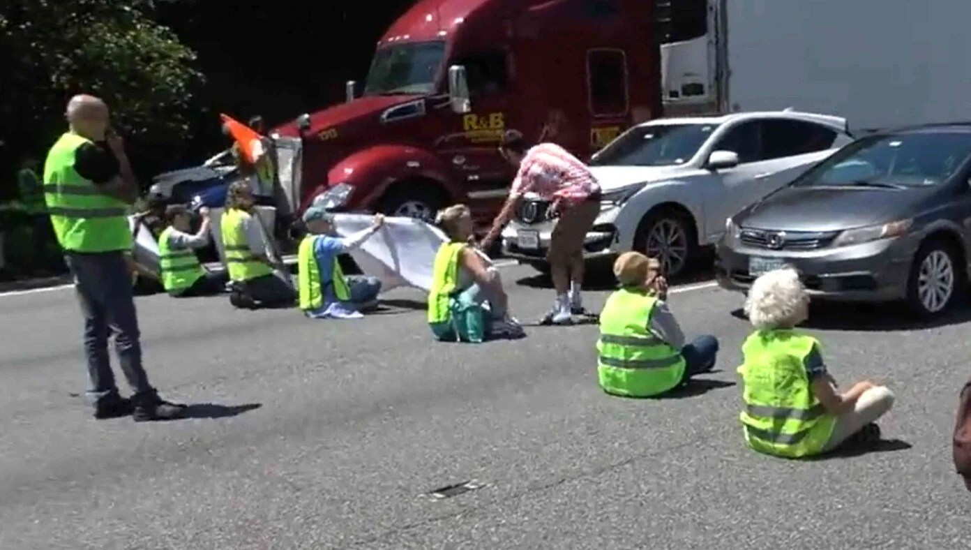 Shared post Success! Climate Protesters Block Traffic Causing Cars To