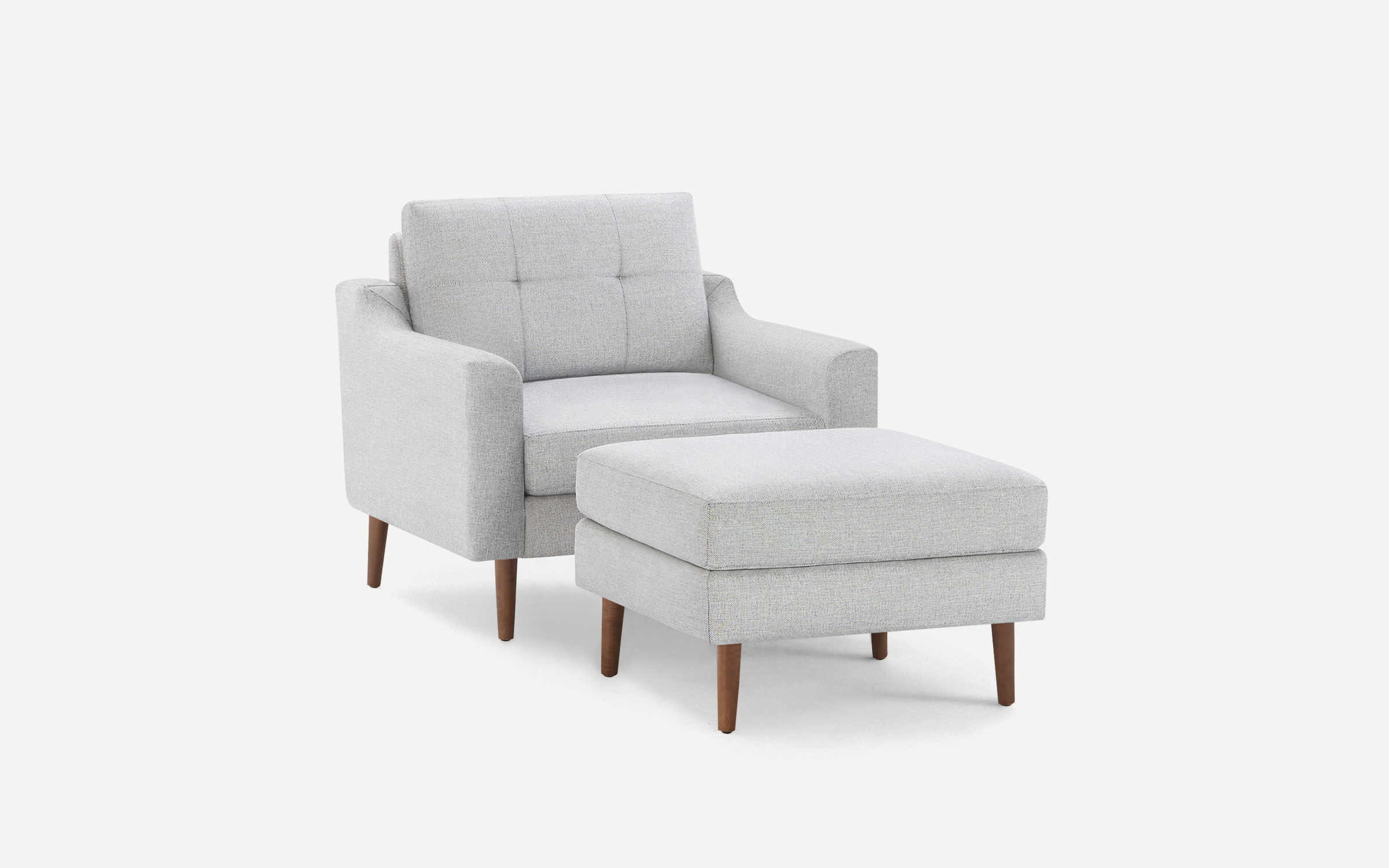 The Nomad Fabric Armchair with Ottoman Burrow